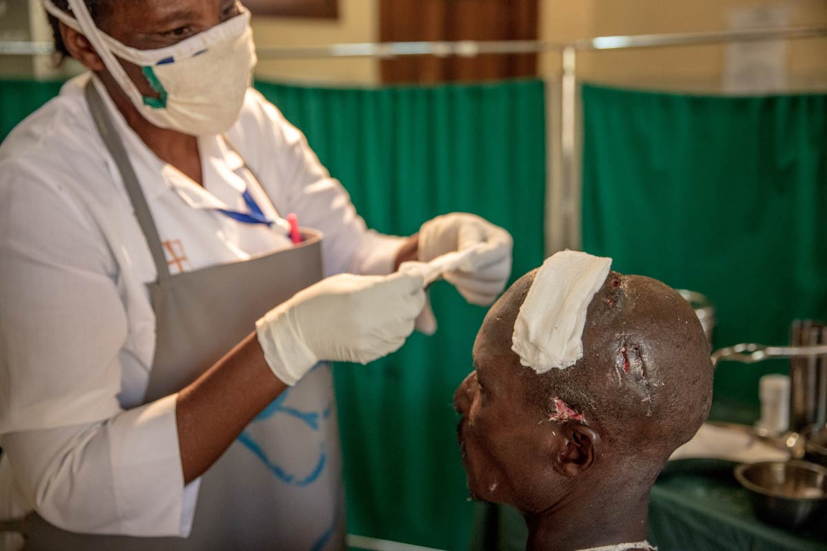 A man from the local community receives treatment at a local clinic for an injury caused by a human-wildlife conflict incident.